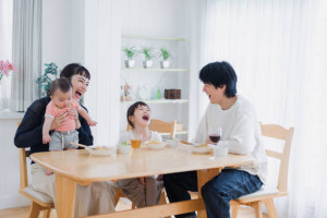 A happy family eating dinner together